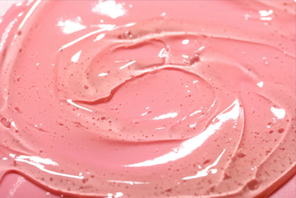 Estimulante feminino em gel e fundo rosa